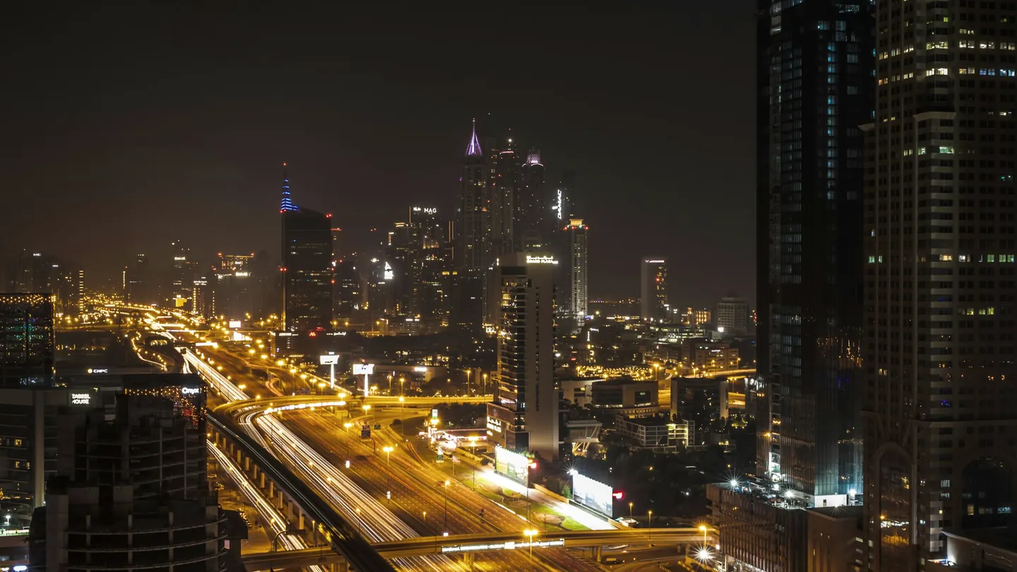 Sheikh Zayed Road and the Dubai skyline illuminated at night